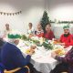 The local group seated about to eat Christmas lunch